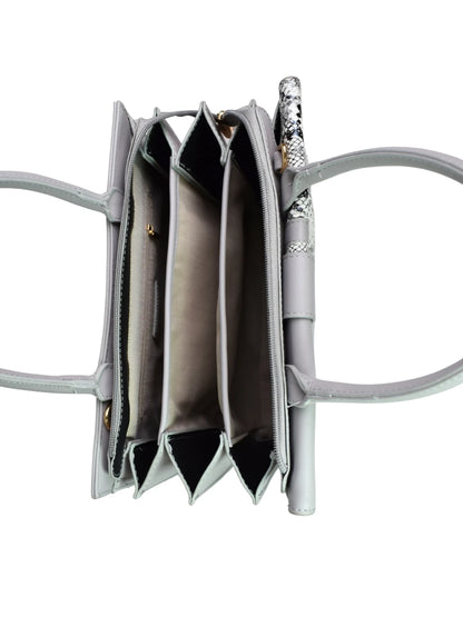 Gray handbag with a pen inside on a white background