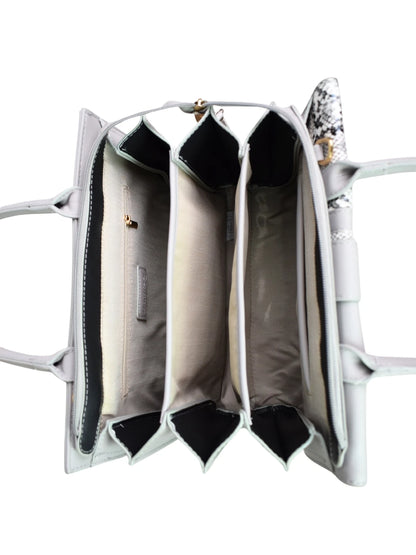 Silver handbag with open design on a white background